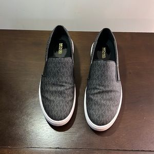 Black Michael Kors size 11 slip on sneakers. Rarely worn.